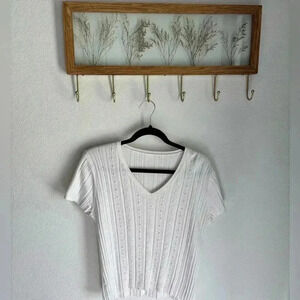 **sold**Light weight coastal knit top in white with pear and crystal details